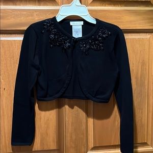 Girl’s black shrug sweater